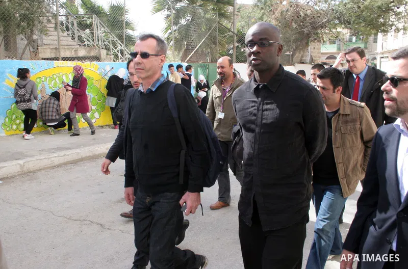,hbjFormer French football player Lilian Thuram (C) looks on during a visit to the divided city of Hebron, in the Israeli-occupied West Bank, on April 13, 2011. Thuram is visiting the Palestinian territories in support o...