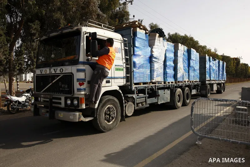 Trucks carrying goods transferred from Israel leaves the Kerem Shalom crossing point in Rafah, in the southern Gaza Strip April 13, 2011. Israel on Wednesday reopened the commercial crossing with the Hamas-ruled Gaza Str...
