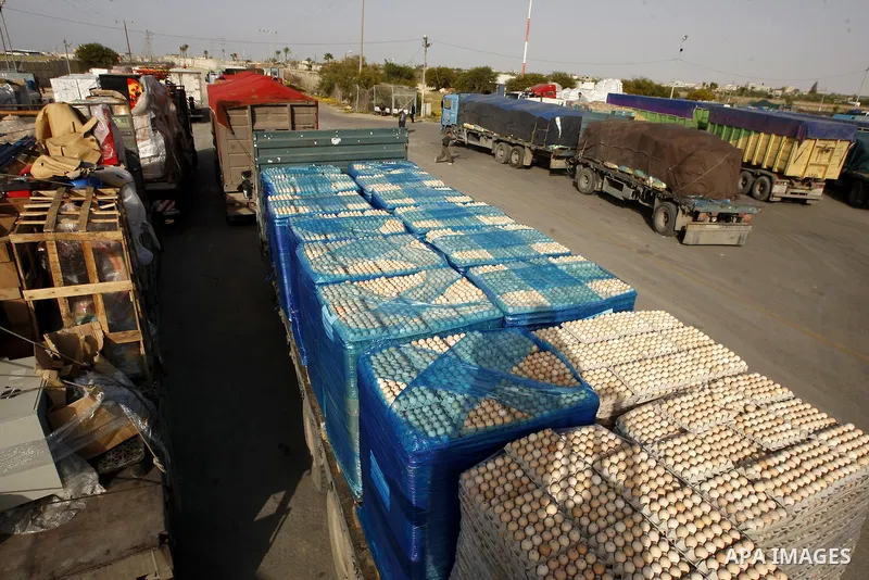 Trucks carrying goods transferred from Israel leaves the Kerem Shalom crossing point in Rafah, in the southern Gaza Strip April 13, 2011. Israel on Wednesday reopened the commercial crossing with the Hamas-ruled Gaza Str...