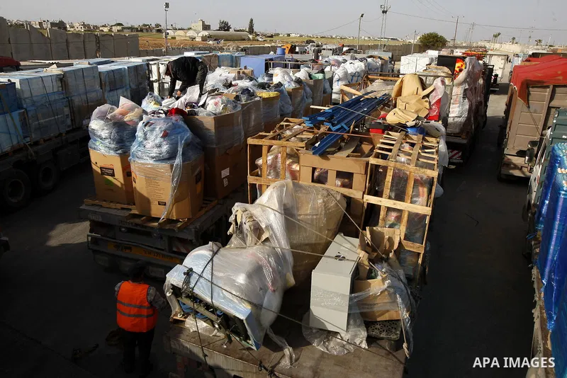 Trucks carrying goods transferred from Israel leaves the Kerem Shalom crossing point in Rafah, in the southern Gaza Strip April 13, 2011. Israel on Wednesday reopened the commercial crossing with the Hamas-ruled Gaza Str...