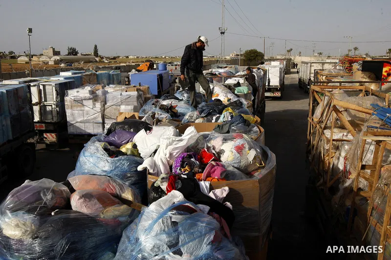 Trucks carrying goods transferred from Israel leaves the Kerem Shalom crossing point in Rafah, in the southern Gaza Strip April 13, 2011. Israel on Wednesday reopened the commercial crossing with the Hamas-ruled Gaza Str...