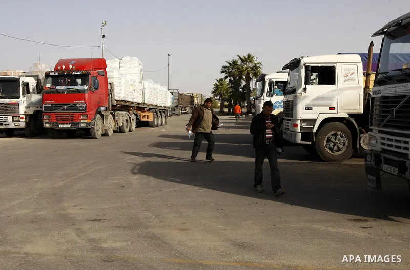 Trucks carrying goods transferred from Israel leaves the Kerem Shalom crossing point in Rafah, in the southern Gaza Strip April 13, 2011. Israel on Wednesday reopened the commercial crossing with the Hamas-ruled Gaza Str...