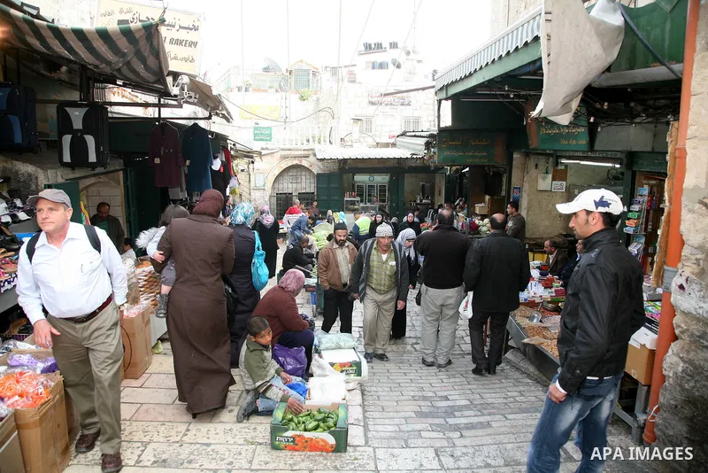 Palestinians shop at the main market in the old city of Jerusalem on April 13, 2011. Photo by Sliman Khader