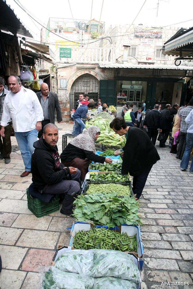 Palestinians shop at the main market in the old city of Jerusalem on April 13, 2011. Photo by Sliman Khader