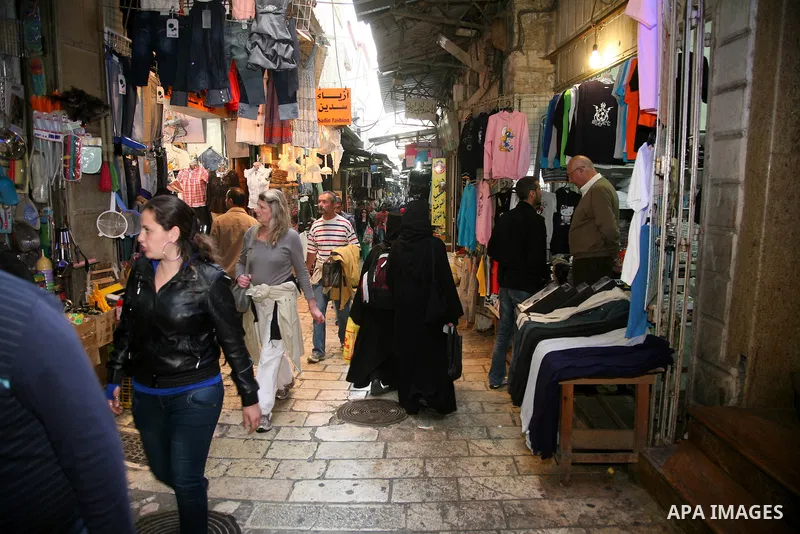 Palestinians shop at the main market in the old city of Jerusalem on April 13, 2011. Photo by Sliman Khader