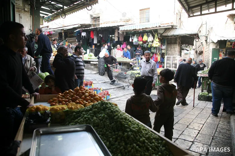 Palestinians shop at the main market in the old city of Jerusalem on April 13, 2011. Photo by Sliman Khader
