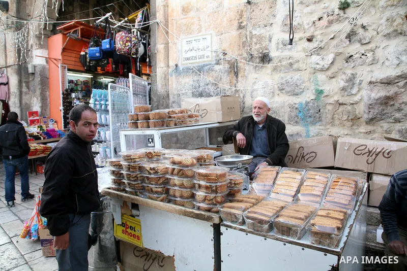 Palestinians shop at the main market in the old city of Jerusalem on April 13, 2011. Photo by Sliman Khader