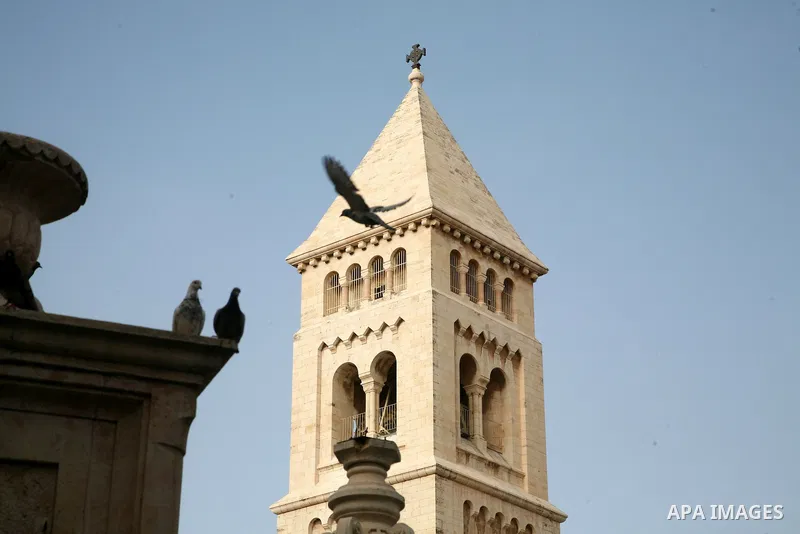 Doves fly over the Church of the Holy Sepulchre (resurrection) in Jerusalem's Old City on April 13, 2011. Photo by Sliman Khader