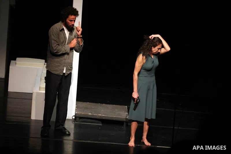 Palestinians perform scenes from the play "The Death of the Virgin" at the conclusion of the Festival "Days of lighthouse" in the West Bank city of Ramallah April 13, 2011. Photo by Issam Rimawi