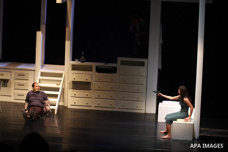 Palestinians perform scenes from the play "The Death of the Virgin" at the conclusion of the Festival "Days of lighthouse" in the West Bank city of Ramallah April 13, 2011. Photo by Issam Rimawi