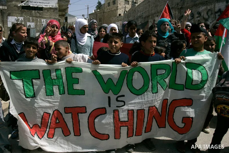 Palestinians protest against the Israeli army's detention of Juliana Awad in the West Bank village of Awarta near Nablus, Thursday, April 14, 2011. Palestinian residents in Awarta say Awad was detained earlier in the wee...