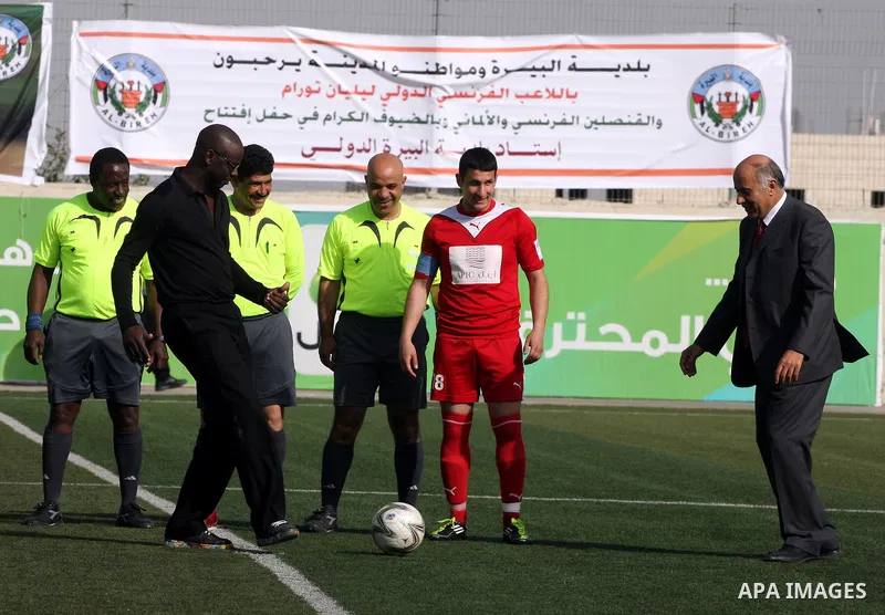 Former French football player Lilian Thuram and the Palestinian Football Association chairman Jibril Rajoub attend the inauguration of a 9,000-capacity stadium, at Al-Bireh, on the outskirts of the West Bank political an...