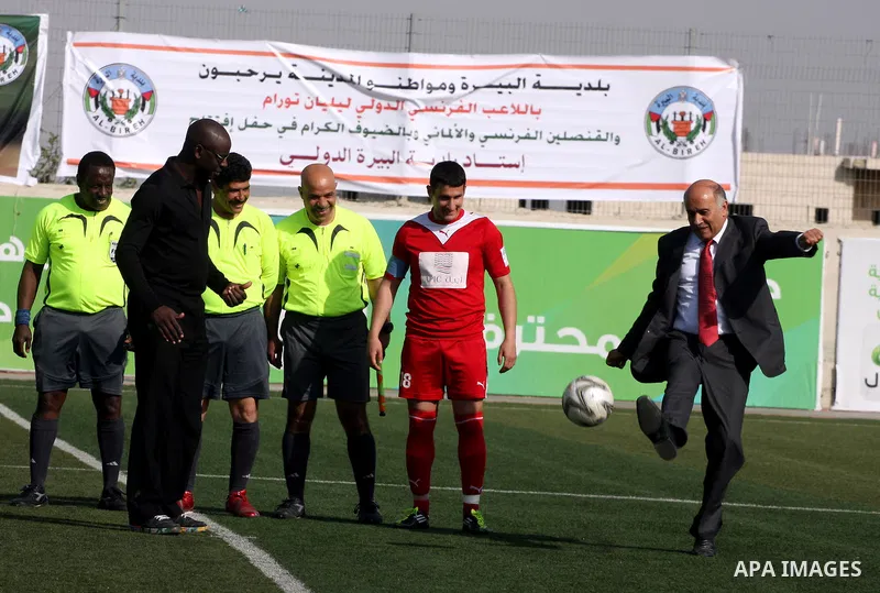 Former French football player Lilian Thuram and the Palestinian Football Association chairman Jibril Rajoub attend the inauguration of a 9,000-capacity stadium, at Al-Bireh, on the outskirts of the West Bank political an...