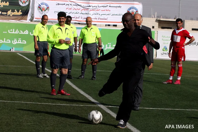 Former French football player Lilian Thuram and the Palestinian Football Association chairman Jibril Rajoub attend the inauguration of a 9,000-capacity stadium, at Al-Bireh, on the outskirts of the West Bank political an...
