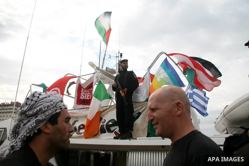 This October 29, 2008 file photo shows Italian peace activist Vittorio Arrigoni at the port in Gaza City celebrating the arrival of the 20-metre (65-foot) ship "Dignity" that departed from Cyprus the previous day to prot...