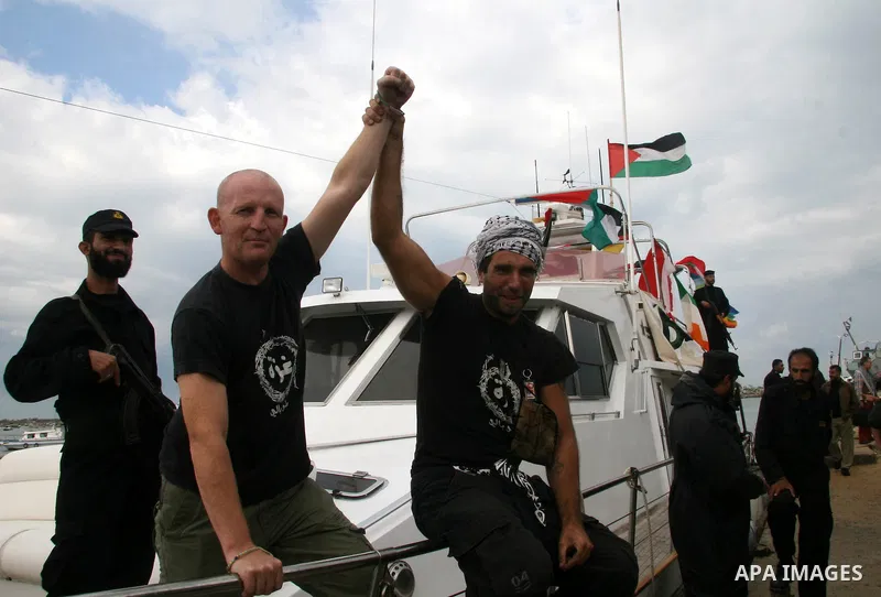 This October 29, 2008 file photo shows Italian peace activist Vittorio Arrigoni at the port in Gaza City celebrating the arrival of the 20-metre (65-foot) ship "Dignity" that departed from Cyprus the previous day to prot...