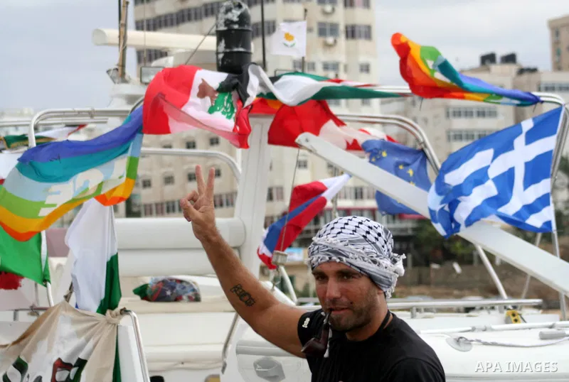This October 29, 2008 file photo shows Italian peace activist Vittorio Arrigoni at the port in Gaza City celebrating the arrival of the 20-metre (65-foot) ship "Dignity" that departed from Cyprus the previous day to prot...