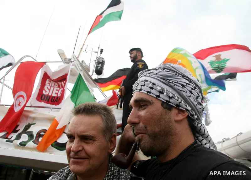 This October 29, 2008 file photo shows Italian peace activist Vittorio Arrigoni at the port in Gaza City celebrating the arrival of the 20-metre (65-foot) ship "Dignity" that departed from Cyprus the previous day to prot...