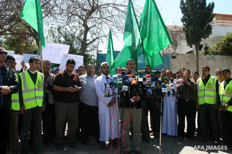 Palestinians hold slogans against the kidnapping and killing of an Italian human rights activist by a Salafist group of radical Islamist, during a protest in Gaza City, on April 15, 2011. International Solidarity Movemen...