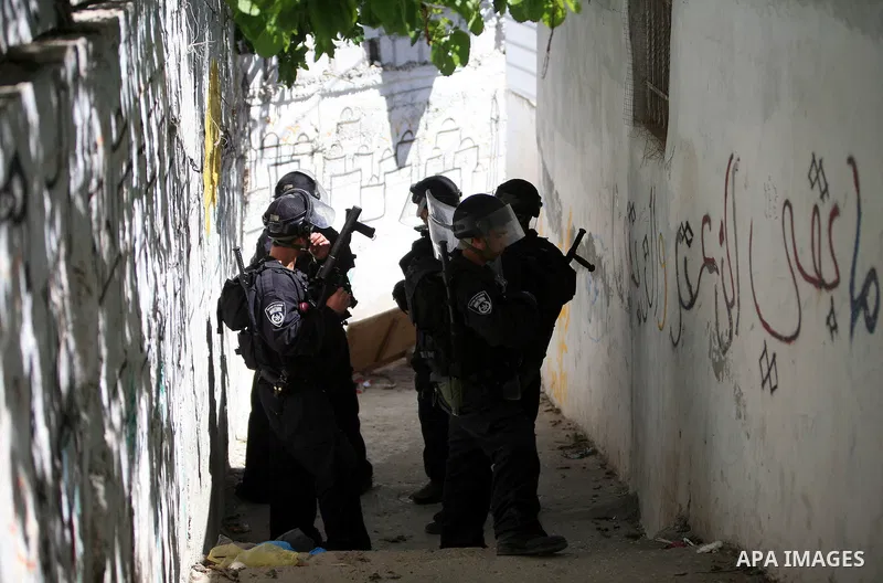Israeli riot policemen take position in the east Jerusalem neighborhood of Silwan on April 15, 2011 following brief clashes between police and stone throwers. Photo by Sliman Khader