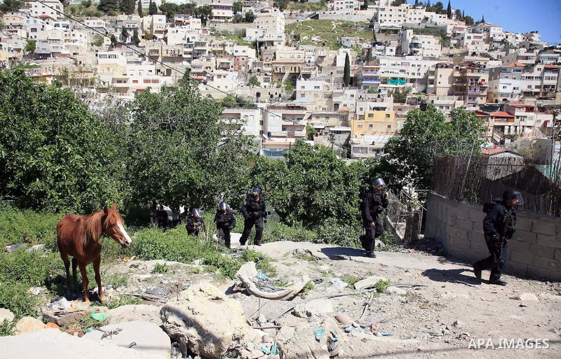 Israeli riot policemen take position in the east Jerusalem neighborhood of Silwan on April 15, 2011 following brief clashes between police and stone throwers. Photo by Sliman Khader