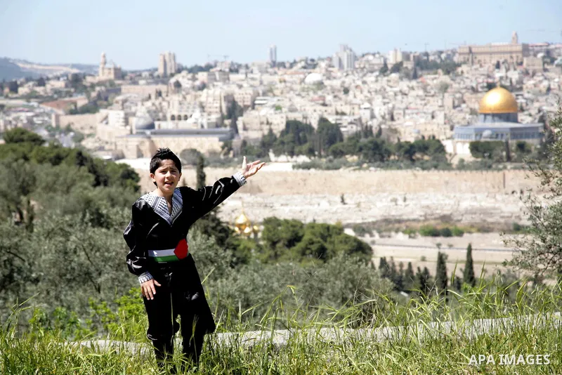 The Palestinian child Issam Bashiti, who was participated in the program Arab's got talent, delivers poetry in front of media in Jerusalem's old city on April 15,2011. The Dome of the Rock shown in the background. Photo...