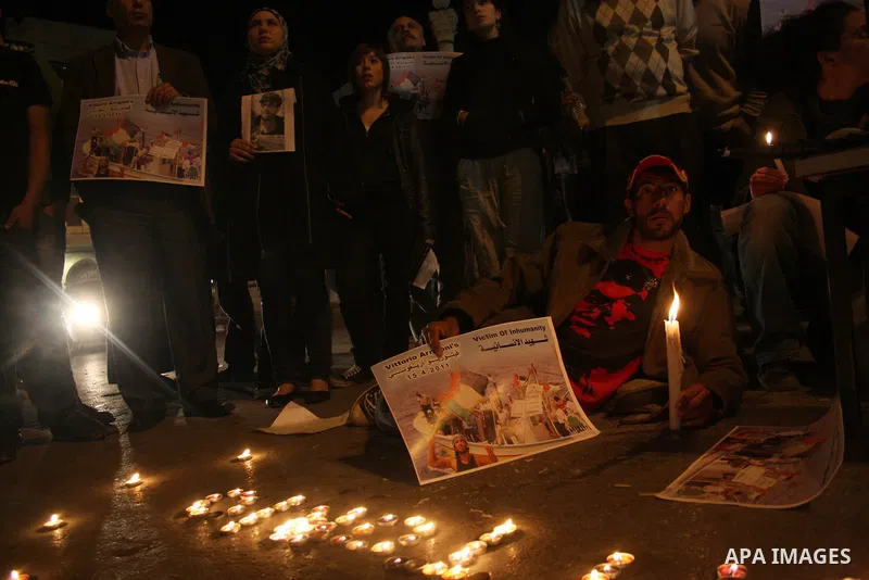 Palestinians take part in a protest against the killing of Italian activist Vittorio Arrigoni in the West Bank of Ramallah April 15, 2011. Hamas found the body on Friday of Arrigoni, a pro-Palestinian Italian activist, w...