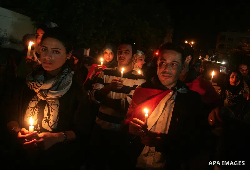 Palestinian light candles during a protest against killing of Italian activist Vittorio Arrigoni in Gaza City, 15 April 2011. Hamas authorities in the Gaza Strip condemned as a 'shameful crime' the kidnap and killing of...