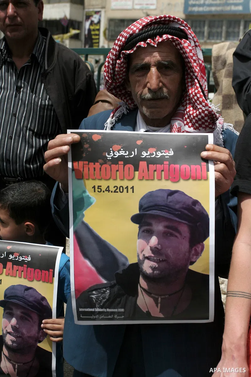 Palestinians and foreign activists take part in a protest against the killing of Italian activist Vittorio Arrigoni in the West bank city of Nablus April 16, 2011. Photo by Wagdi Eshtayah
