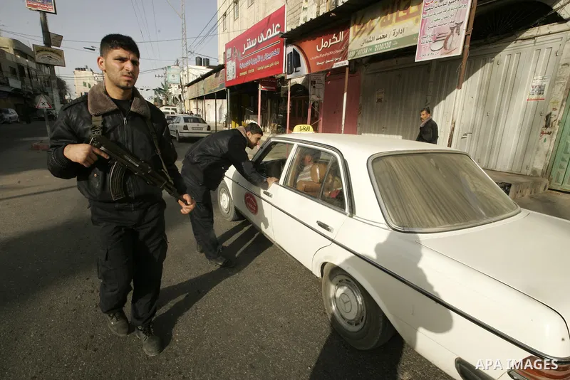 Members of Hamas' security forces patrol in the Gaza border town of Rafah, on April 16, 2011, after a radical Islamist group killed an Italian activist just hours after kidnapping him. The Hamas government said today it...