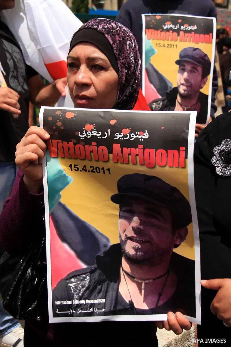 Palestinians and foreign activists take part in a protest against the killing of Italian activist Vittorio Arrigoni in the West bank city of Nablus April 16, 2011. Photo by Wagdi Eshtayah
