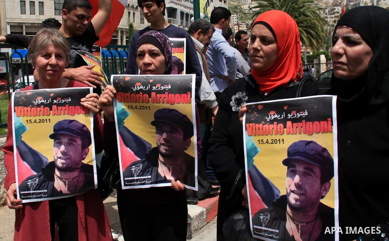 Palestinians and foreign activists take part in a protest against the killing of Italian activist Vittorio Arrigoni in the West bank city of Nablus April 16, 2011. Photo by Wagdi Eshtayah