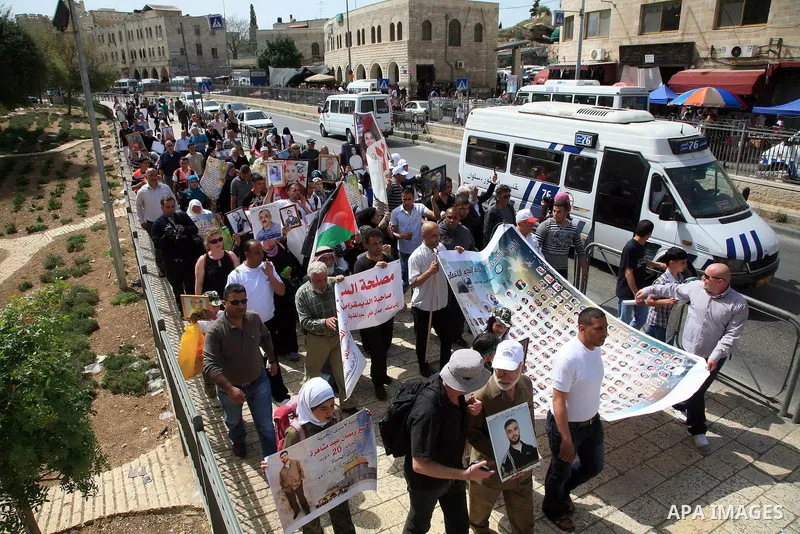 March from the Damascus Gate in East Jerusalem to the Red Cross headquarters where the Palestinian Legislative Council sitters since 290 days, demanding the release of prisoners from Israeli jails. April 16 2011. Sliman...