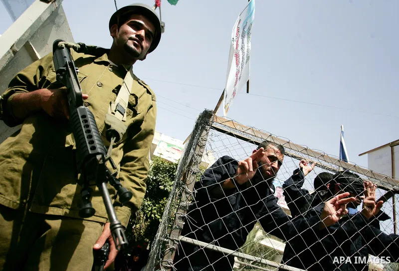Palestinians participate in a rally, one of several taking place across the Israeli occupied West Bank and Gaza Strip, calling for the release of Palestinians being held in Israeli jails, as they mark Palestinian Prisone...