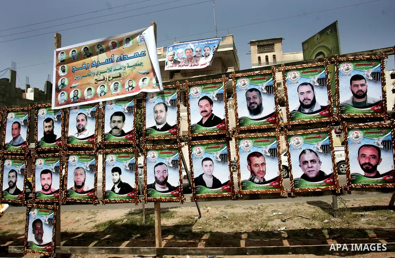 Palestinians hold pictures of their jailed relatives during a rally, one of several taking place across the Israeli occupied West Bank and Gaza Strip, calling for the release of Palestinians being held in Israeli jails,...