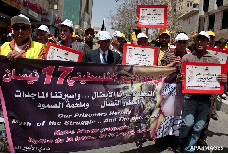 Palestinians take part in a rally, one of several taking place across the Israeli occupied West Bank and Gaza Strip calling for the release of Palestinians being held in Israeli jails, as they mark Palestinian Prisoner's...