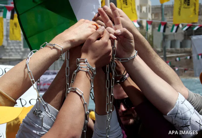 Palestinians take part in a rally, one of several taking place across the Israeli occupied West Bank and Gaza Strip calling for the release of Palestinians being held in Israeli jails, as they mark Palestinian Prisoner's...