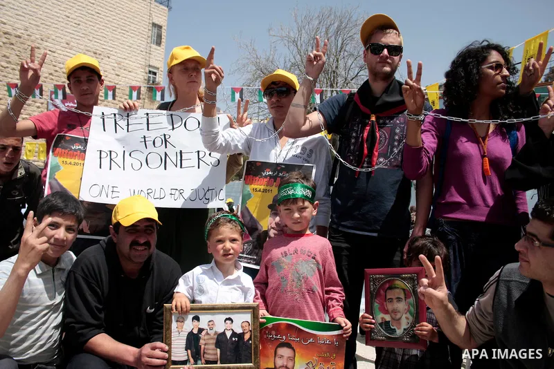 Palestinians take part in a rally, one of several taking place across the Israeli occupied West Bank and Gaza Strip calling for the release of Palestinians being held in Israeli jails, as they mark Palestinian Prisoner's...
