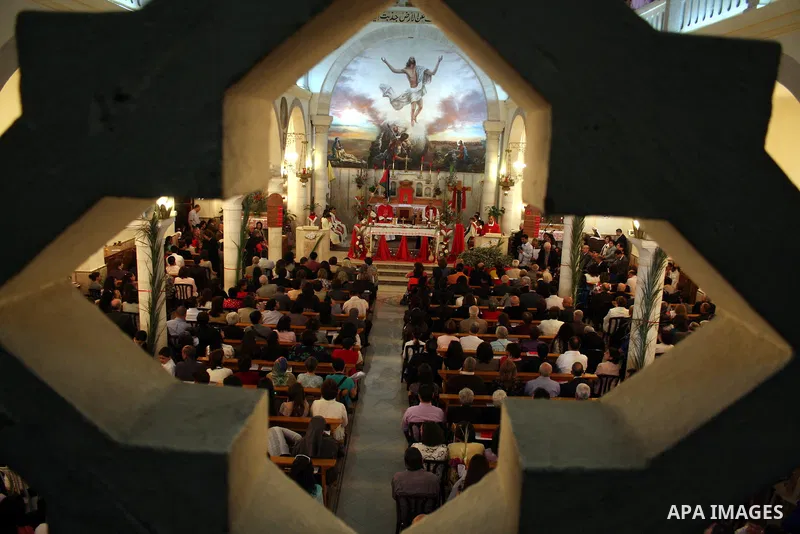 Palestinian Christians take part on Orthodox Palm Sunday in the West Bank city of Ramallah, Sunday, April 17, 2011. Palm Sunday commemorates Jesus Christ's triumphant entry into Jerusalem, and is the start of the church'...