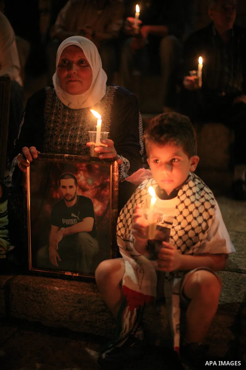 Palestinians light candles during a protest to mark Prisoner's Day in front Damascus Gate in Jerusalem's old city, Sunday, April 17, 2011. Some 5,500 Palestinians are held in Israeli prisons according to figures compiled...