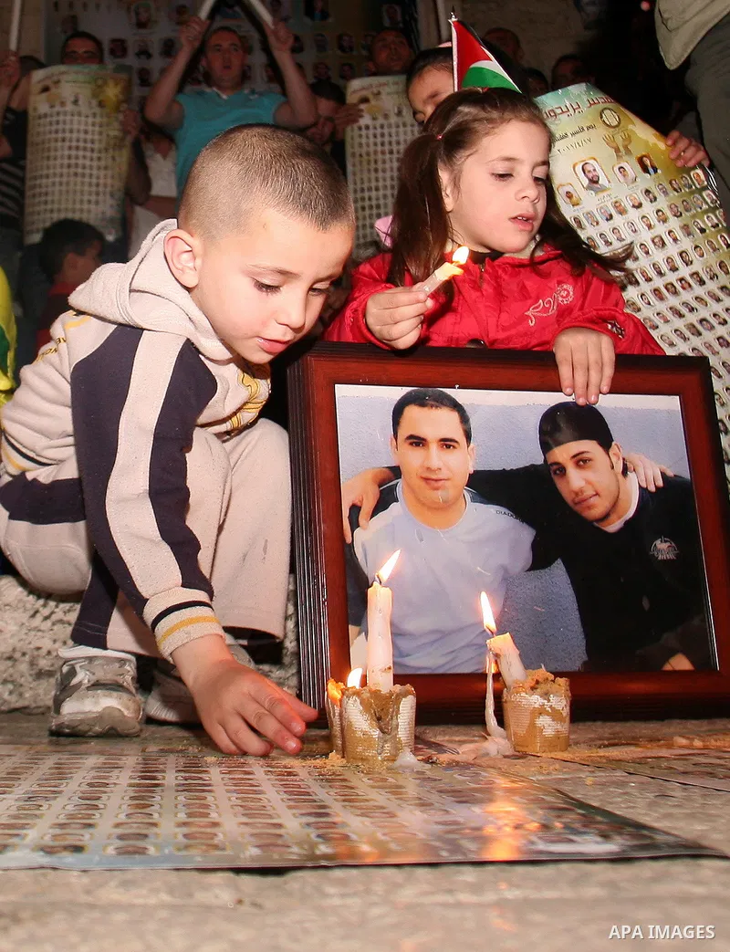 Palestinians light candles during a protest to mark Prisoner's Day in front Damascus Gate in Jerusalem's old city, Sunday, April 17, 2011. Some 5,500 Palestinians are held in Israeli prisons according to figures compiled...