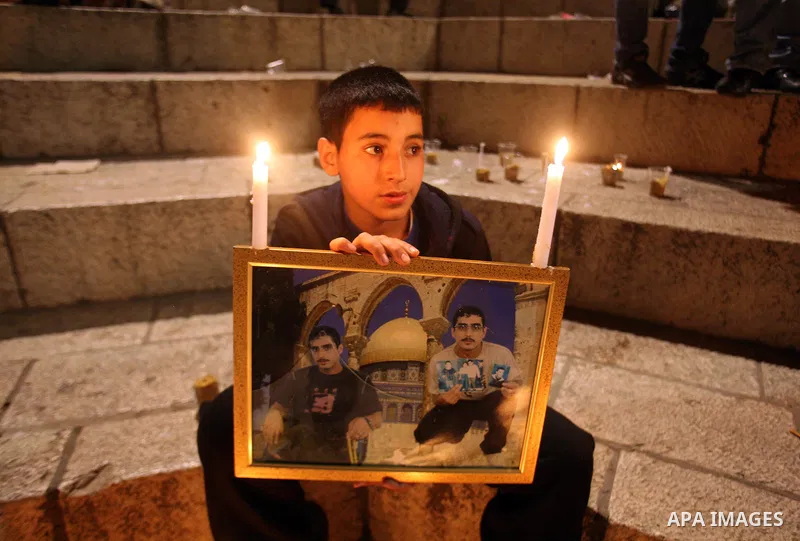Palestinians light candles during a protest to mark Prisoner's Day in front Damascus Gate in Jerusalem's old city, Sunday, April 17, 2011. Some 5,500 Palestinians are held in Israeli prisons according to figures compiled...