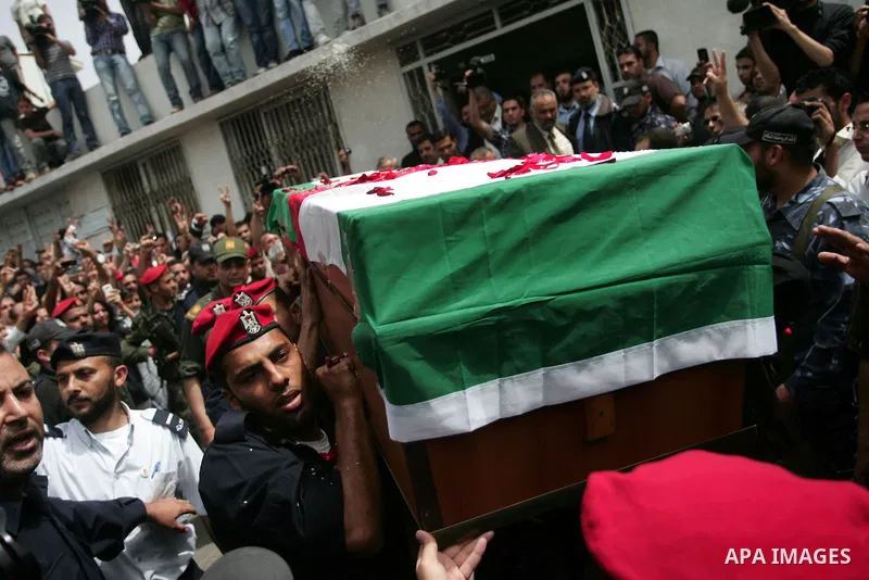 Palestinian Hamas security personnel carry the coffin of the pro-Palestinian Italian activist Vittorio Arrigoni during his funeral in Gaza City, Gaza Strip, 18 April 2011. After the funeral, the body of Vittorio Arrigoni...