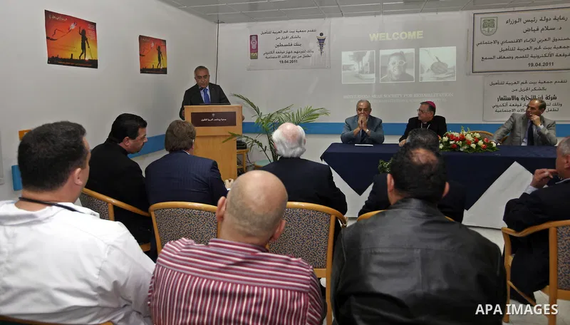 Palestinian Pime Minister, Salam Fayyad during the opening of the draft electronic implant for the deaf, dumb and hearing-impaired at the Bethlehem Arab Society for Rehabilitation on April 19,2011. Photo by Mustafa Abu D...