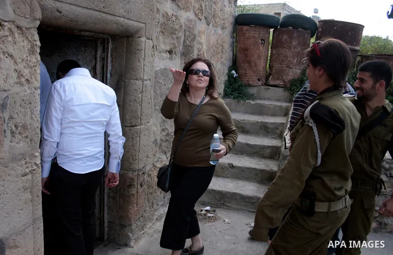 Israeli soldiers stand guard in an empty street in Hebron in the occupied West Bank on April 20, 2011. The Israeli army imposed a temporary curfew on Palestinians in the city centre to allow Jewish settlers to visit the...