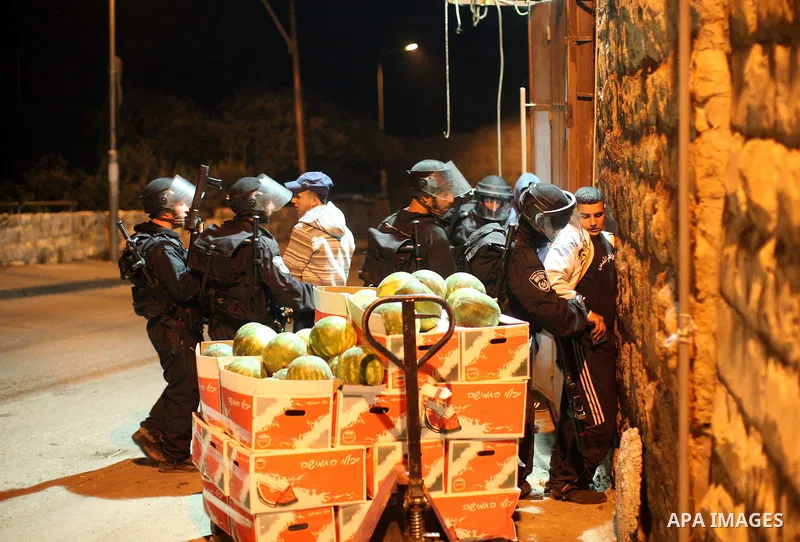 Israeli soldiers detain a Palestinian youth during the clashes in the Jerusalem neighbourhood of Silwan on April 20,2011. Photo by Sliman Khader