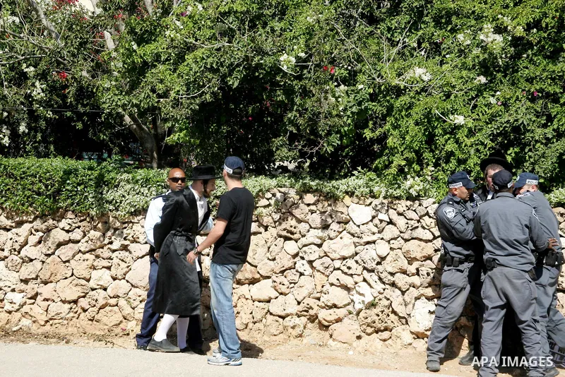Ultra-Orthodox demonstrators scuffle with police during a protest near Tel Aviv April 21, 2011. protest against the excavation of graves. photo by MAhfouz Abu Turk