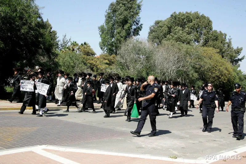 Ultra-Orthodox demonstrators scuffle with police during a protest near Tel Aviv April 21, 2011. protest against the excavation of graves. photo by MAhfouz Abu Turk