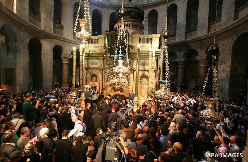 Christians Orthodox take part in Easter "Holy Fire" celebrations on the eve of Easter Sunday on April 23, 2011, at the Church of the Holy Sepulchre, built over the sites where Christians believe Christ was crucified and...
