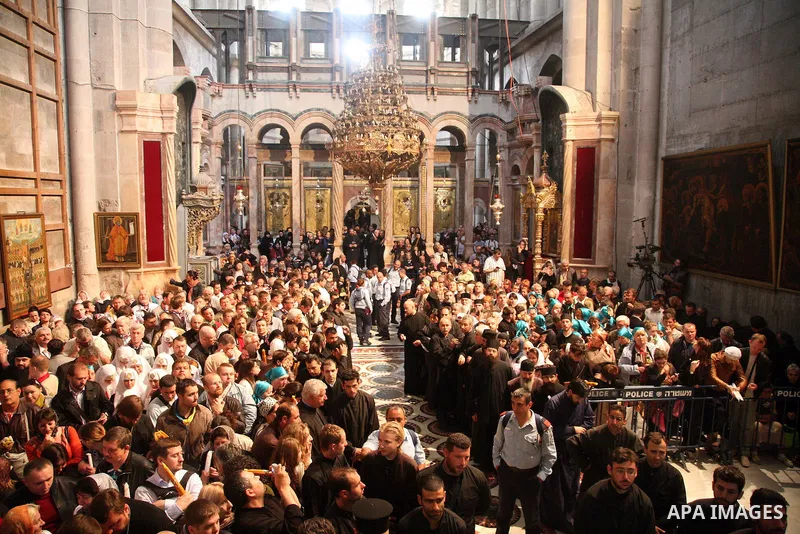 Christians Orthodox take part in Easter "Holy Fire" celebrations on the eve of Easter Sunday on April 23, 2011, at the Church of the Holy Sepulchre, built over the sites where Christians believe Christ was crucified and...